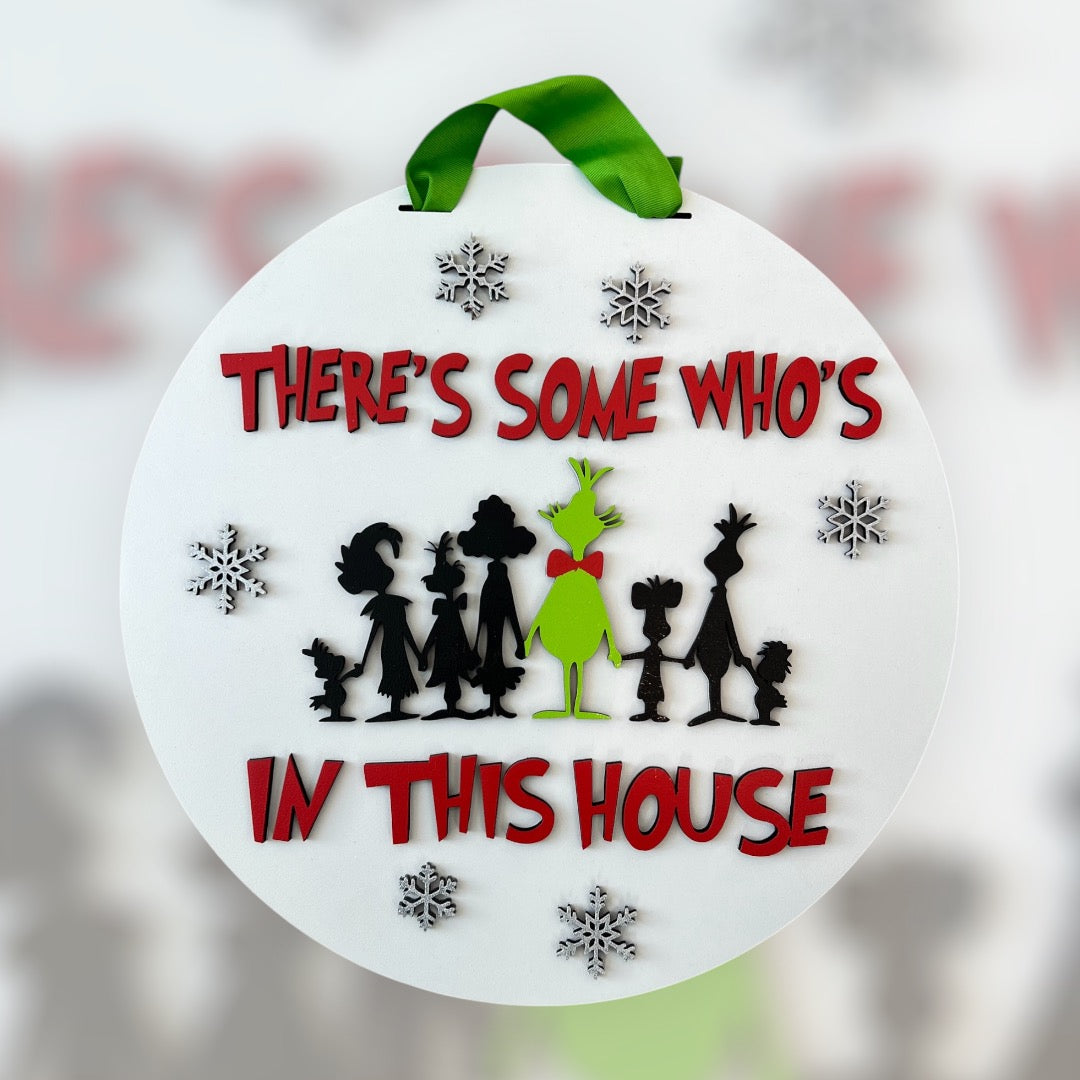 There's Some Who's In This House Door Hanger